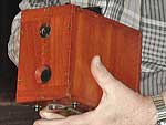 camera in hand -- note the holding strap on the bottom 