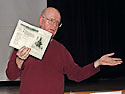 Robert Gutteridge holds up the lot details