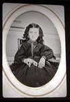 young girl holding a small tintype album