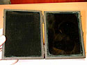 opened, the case reveals a Claude Lorraine glass