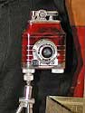 tuxi and lighter on its tripod