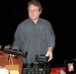Peter holding 12 and 4 lens cameras